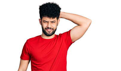 Sticker - Young arab man with beard wearing casual red t shirt confuse and wonder about question. uncertain with doubt, thinking with hand on head. pensive concept.