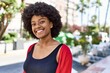 © Krakenimages.com - Young african american girl smiling happy standing at the city.