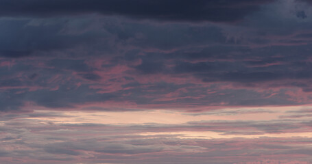 Wall Mural - Purple clouds last minutes before sunset