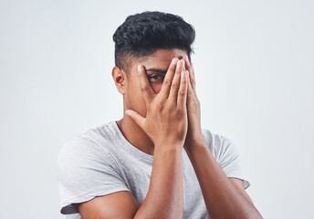 Poster - Lets go a bit deeper than appearance. Studio shot of a young man posing against a white background.