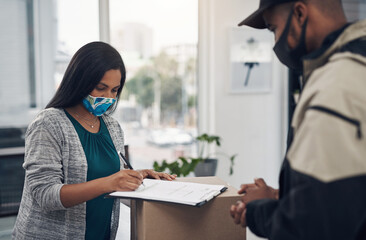Poster - Everything is perfectly in order. Shot of a masked young woman signing for a delivery received at home.