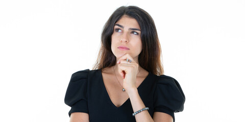 Wall Mural - portrait of pensive young happy woman smiling hand on chin on white background