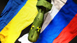 Ukraine and Russia nuclear war, conflict and crisis. National flags and an atom bomb with radioactive logo to symbolize a nuclear threat and possible escalation., 3d illustration