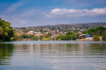 Tuxtla Gutierrez City view from the water on a boat tour of Sumidero Canyon, Chiapas state, Yucatan, Mexico.