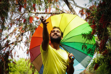 Wall Mural - Boy in spring season with colored umbrella holidays with umbrella outdoor