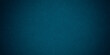 © gojalia - Dark blue background texture with black vignette in old vintage grunge textured border design, dark elegant teal color wall with light