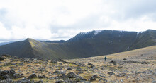 A Walker Heading Towards Lower Man And Helvellyn In The Lake District