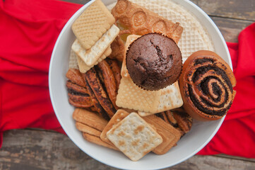 Pastries bowl on wooden backdrop