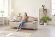 © Studio Romantic - Clam millennial Caucasian girl sit rest on sofa in living room sleep or take nap. Happy young woman relax on comfortable couch furniture at home, daydream doze, relieve negative emotion. Stress free.