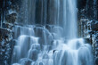 Long exposure of waterfall over the icy wall