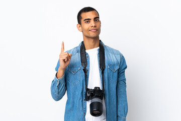 Young African American photographer man over isolated white background pointing with the index finger a great idea