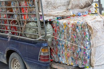 Nakhon Si Thammarat, Thailand : Truck of unused glass bottles and plastic bottles Sold at an antique shop on July 30, 2021 in Thailand.