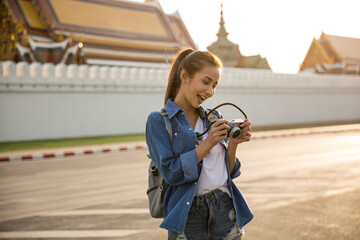 Wall Mural - Young Asian Lady Backpacker