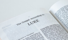 Luke Gospel From Holy Bible Book Inspired By God And Jesus Christ, A Closeup. New Testament Scripture Isolated On A White Background.