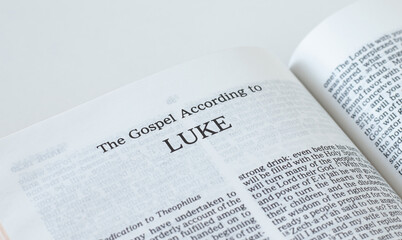 Poster - Luke Gospel from Holy Bible Book inspired by God and Jesus Christ, a closeup. New Testament Scripture isolated on a white background.