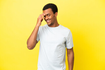 Wall Mural - African American handsome man on isolated yellow background laughing