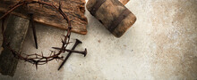 Crucifixion Of Jesus Christ. Cross With Three Nails And Crown Of Thorns On Ground