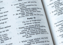 Psalm 32, The Joy Of Forgiveness Verses, Open Holy Bible Book. A Closeup. The Christian Biblical Concept Of Salvation And Joy In God Jesus Christ.