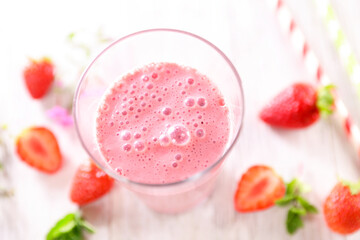 Wall Mural - strawberry smoothie in glass with strawberries