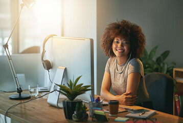 Poster - These extra hours have really paid off. Portrait of a successful young woman working a late shift at the office.
