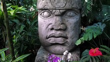 Olmec Sculpture Carved From Stone. Mayan Symbol - Big Stone Head Statue In A Jungle