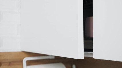 soft close hinges on door of kitchen cabinets at home. special mechanism designed to smoothly close 