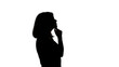 Silhouette of young black woman thinking something.