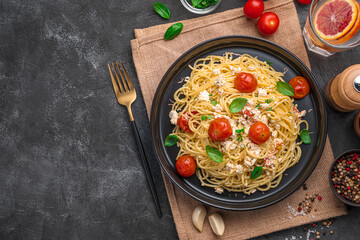 Wall Mural - A popular recipe for pasta with feta made from cherry tomatoes, feta cheese, garlic and herbs.