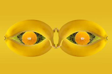 eyes made of fruits banana, kiwi, orange