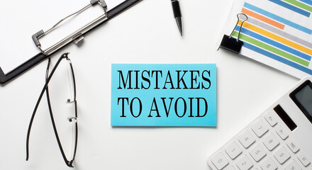 Poster - Stickers with chart,calculator and paper with text MISTAKES TO AVOID on the white background