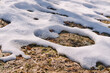 Melting snow on the fields in early spring. Natural spring background.