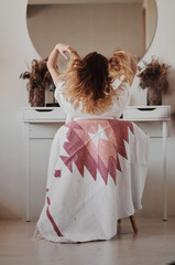 Canvas Print - girl from behind front of the mirror. Cozy interior