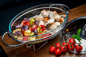 Wall Mural - Stew with different types of fish and grilled vegetables.