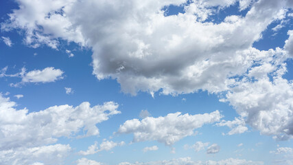 Wall Mural - cumulus clouds and blue sky suitable for background or sky replacement.