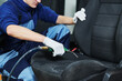automobile detailing. Car seat cleaning with compressed air