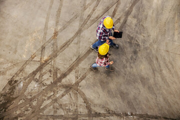 Walking on concrete with muddy care tire print.