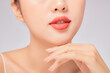 © Tuan  Nguyen  - A close view of model showing lip posing with hand for cosmetic advertising