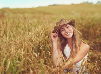 Canvas Print - Out here is where I belong. Cropped shot of a young woman in a wheat field.