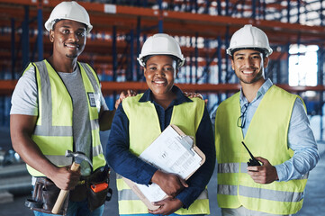 Poster - Shes the woman in charge. Shot of a group of contractors standing together in the warehouse.