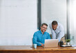 © Delmaine Donson/peopleimages.com - Two heads are always better than one. Shot of two businessmen working on a laptop in their office.