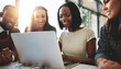 © Delmaine Donson/peopleimages.com - Theyre a well-matched team. Shot of a group of young businesspeople working together around a laptop in the office.