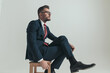 © Viorel Sima - side view of sexy businessman with legs crossed looking up
