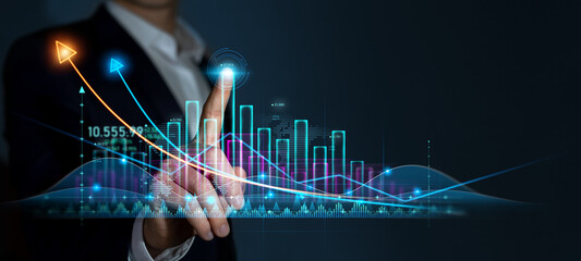 Businessman draws growing virtual hologram of statistics, graph and chart. Investment of growth on currency rate. Business strategy development  plan.