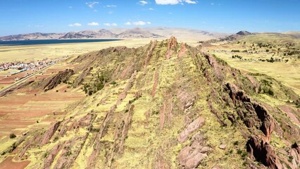 Wall Mural - Flight above rock formations in Aramu Muru near Puno in Peru