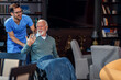 © Zoran Zeremski - Male nurse assisting senior man in a wheelchair at nursing home.