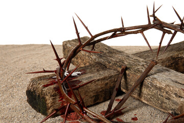 Wall Mural - Crown of thorns with wooden cross, nails and blood drops on sand against white background