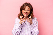 Young Caucasian Woman Isolated On Pink Background Upset Screaming With Tense Hands.