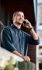 Aufkleber - Its time to get your name out there. Shot of a young businessman standing on an office balcony and using a smartphone.