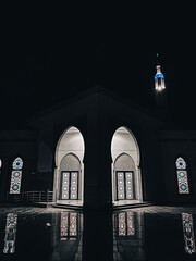 Wall Mural - Vertical shot of a mosque with a beautiful design at night