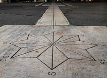 Low Angle View Of The Sundial In The Old Square In Upper Bergamo